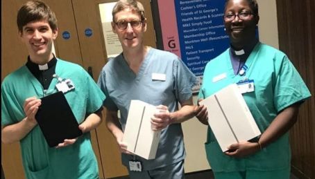 Chaplaincy team holding the newly donated iPads.jpg
