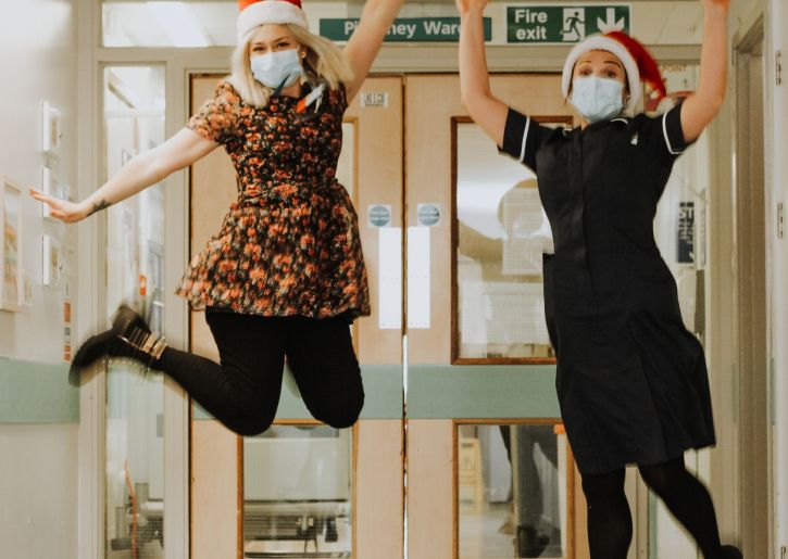 Stevi & colleague jumping in Christmas gear.jpg